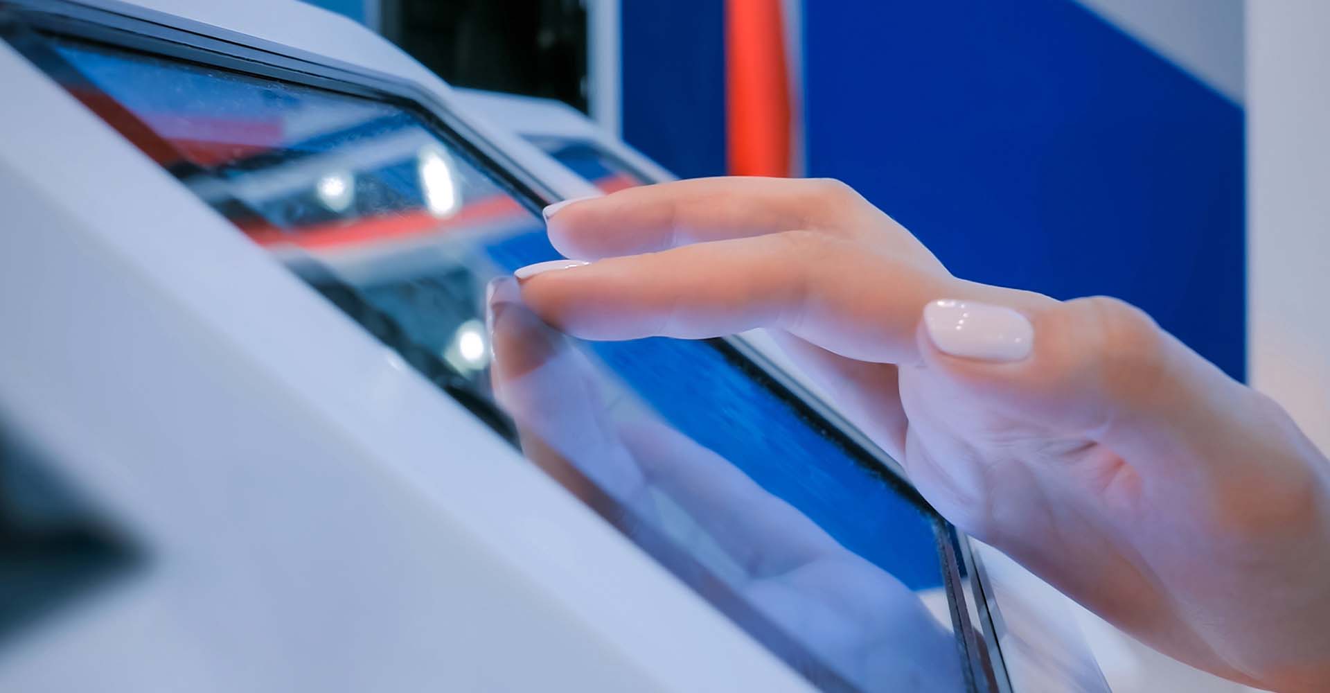 Finger touching a kiosk screen