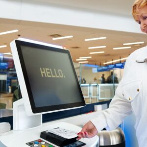 woman using kiosk