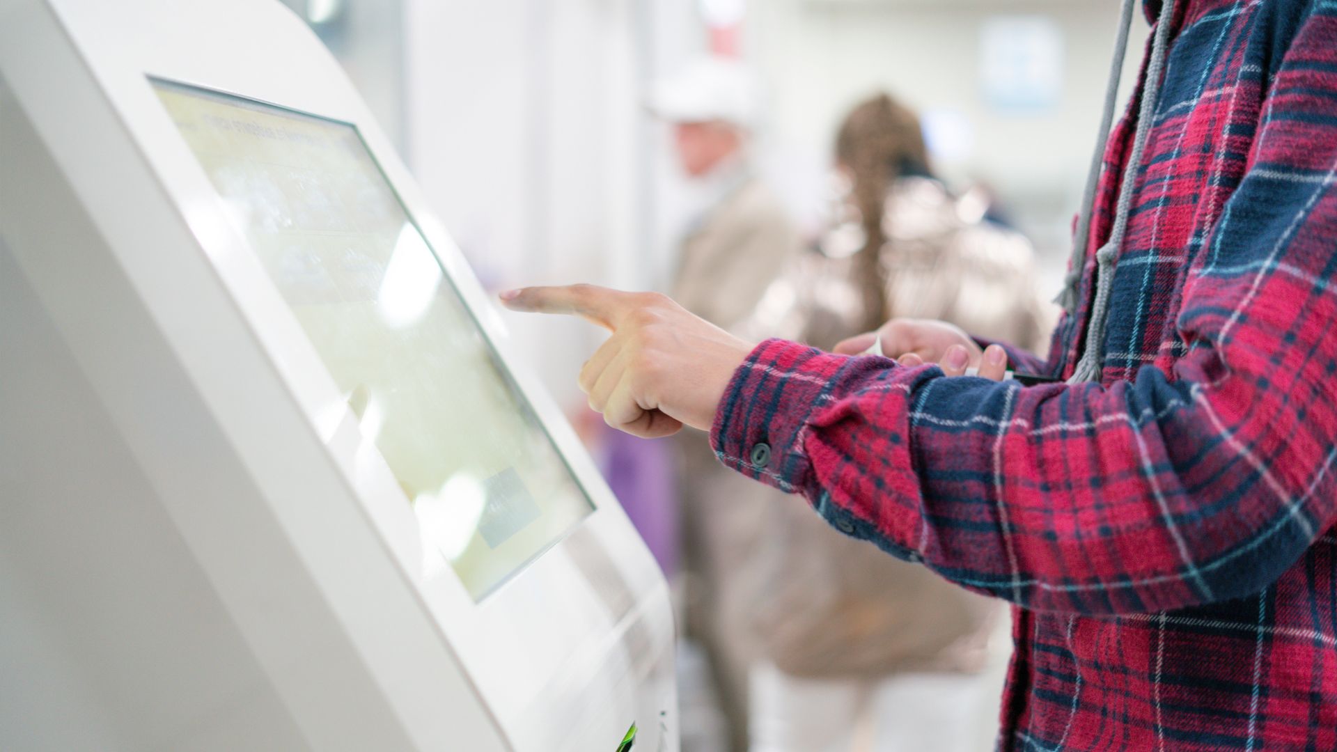 hand using kiosk