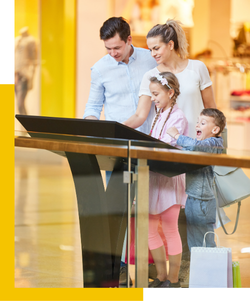family using a kiosk