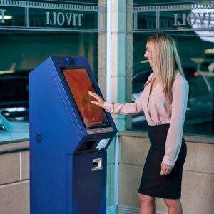 A woman using a kiosk