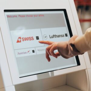 A person using a kiosk at an airport