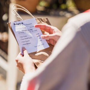 A person reviewing a food order